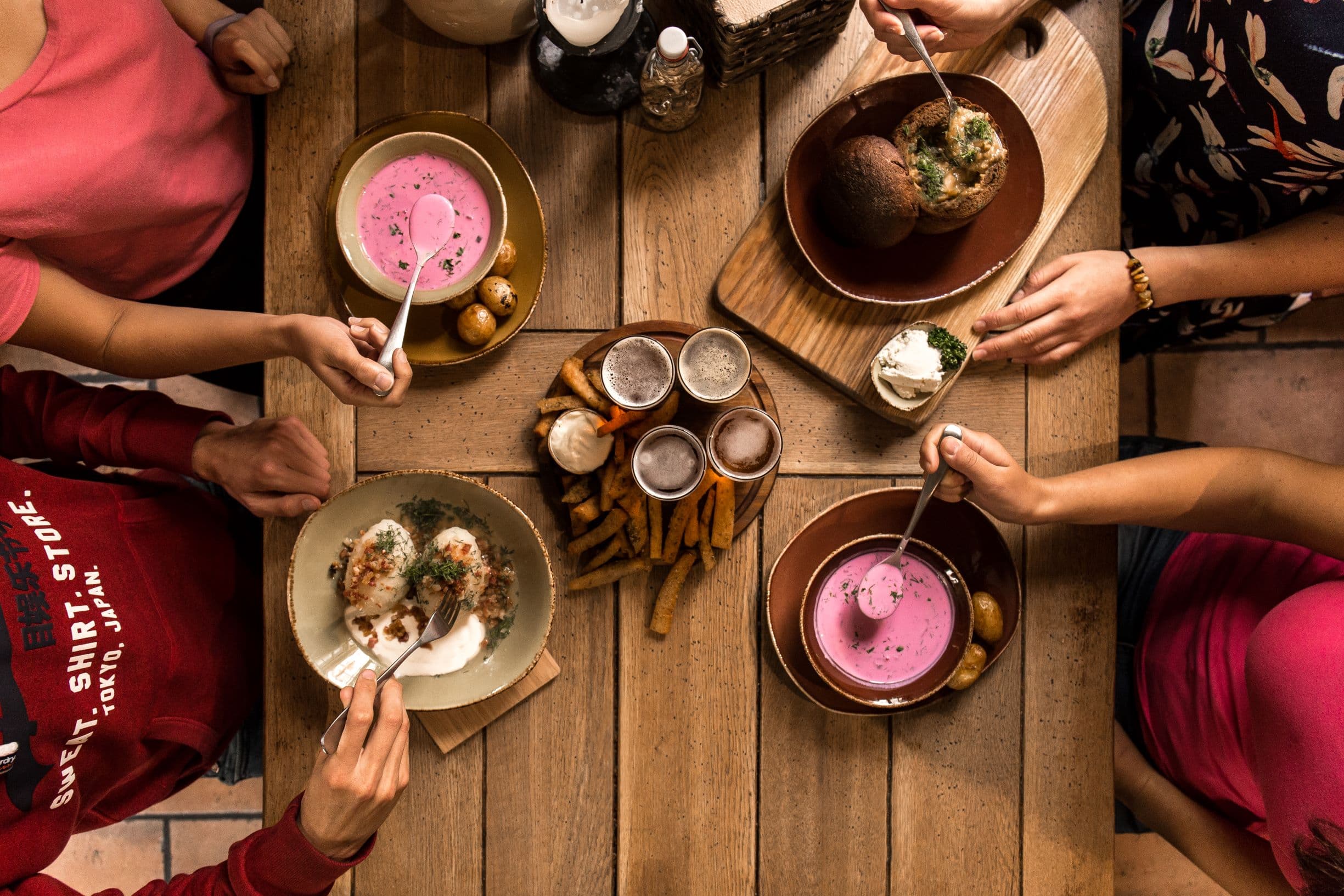 traditional Lithuanian dishes: cepelinai, saltibarsciai, beer, fried bread