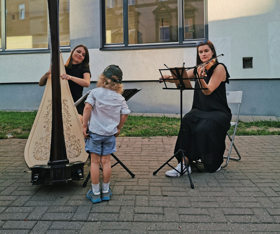 musicians playing classical music instruments street