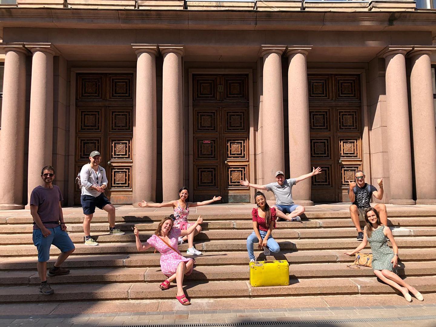 Riga free tours people on stairs posing