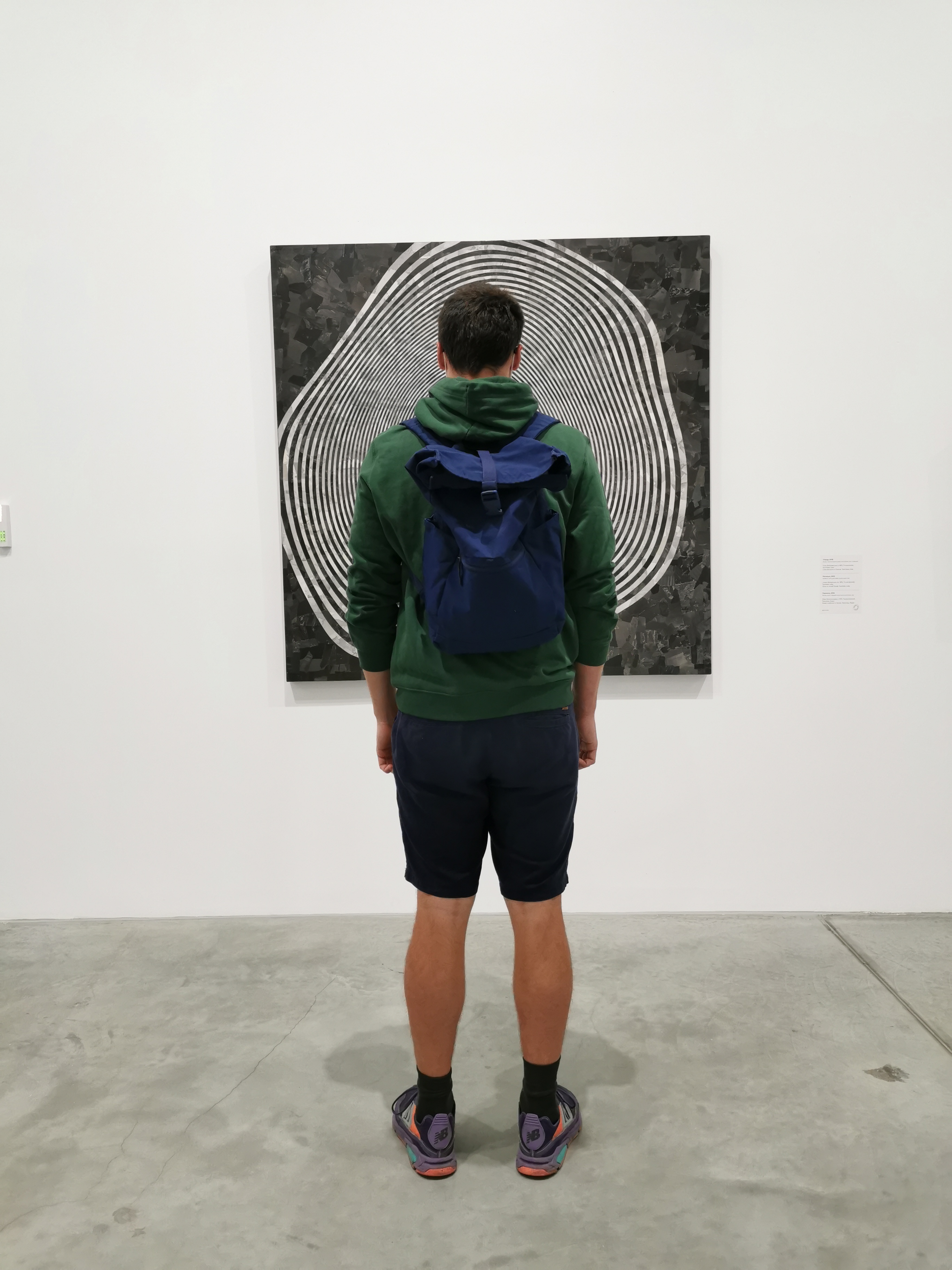 person posing Infront of painting