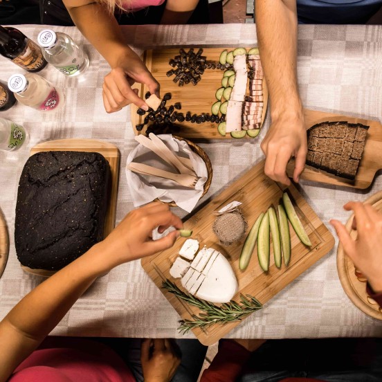 A moment of tasting local snacks from private Vilnius city tour